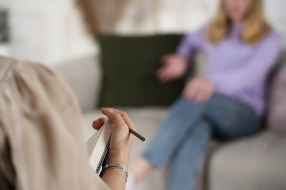 Gesprek tussen een psycholoog en een cliënt.